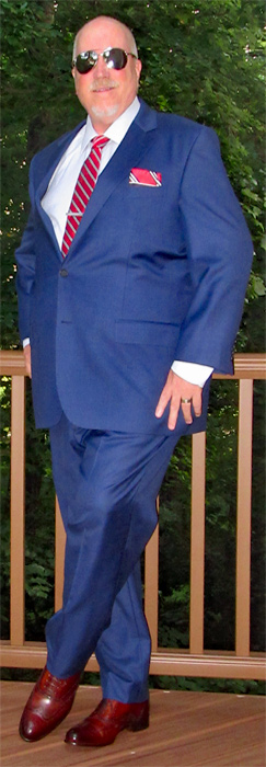 Paul Evans brown wingtip oxford dress shoes with a blue suit